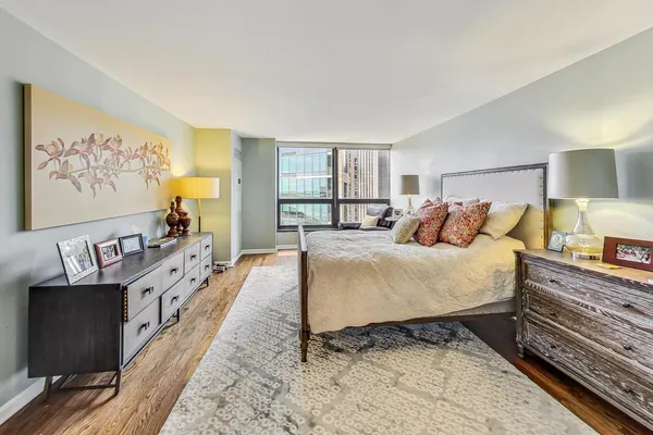 a bedroom with a bed and a couch