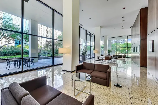a living room with furniture and a large window