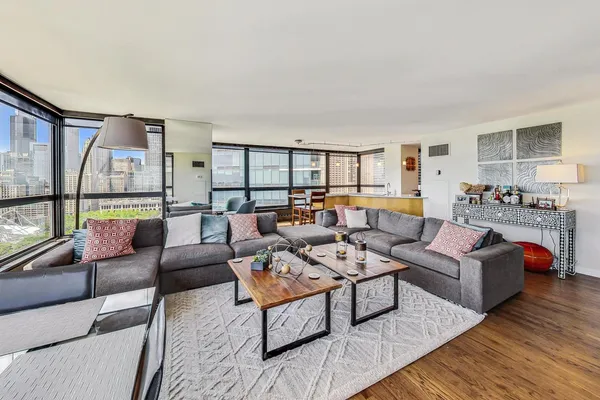 a living room with furniture and a table