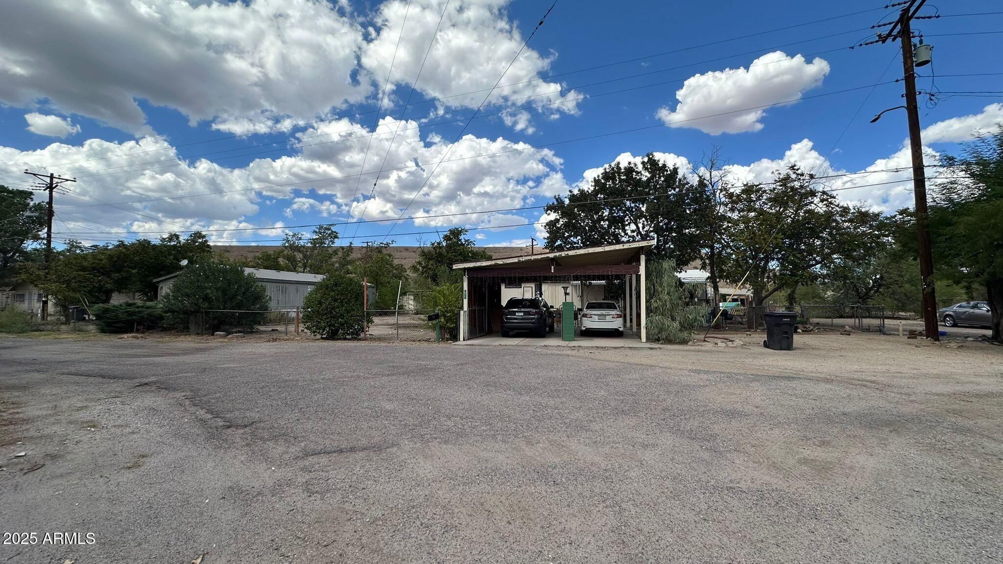 4518 Broadway Claypool, AZ 85532 - Photo 2 of 5 a front view of a house with a yard and garage