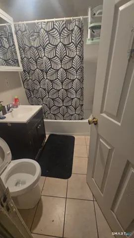 a bathroom with a toilet and a sink