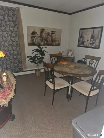 a view of a livingroom with furniture and a couch