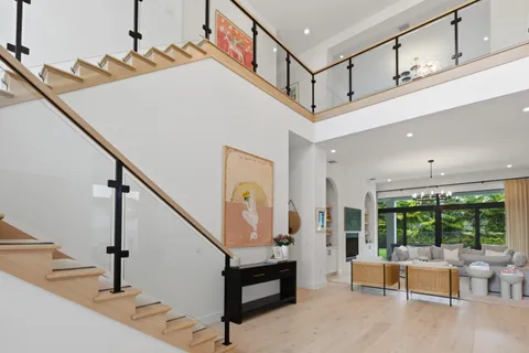 a view of livingroom with furniture and staircase