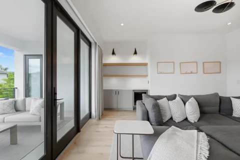a view of a workspace with furniture and lounge chair