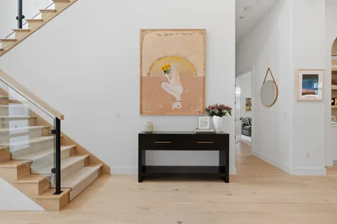 a view of living room with furniture and a potted plant