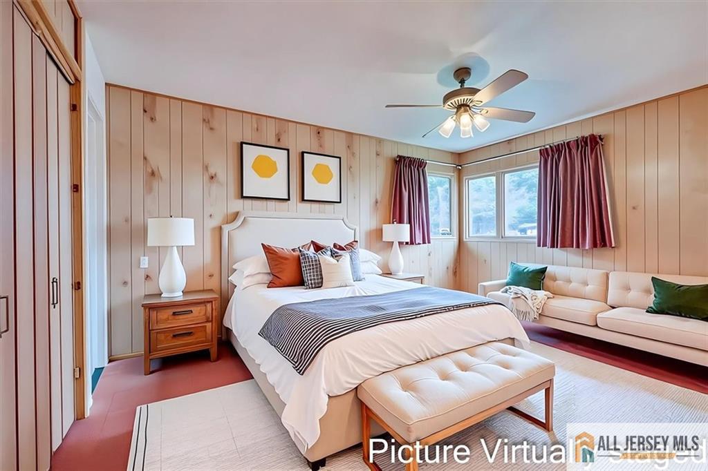 21 Tyndall Road Kendall Park, NJ 08824 - Photo 14 of 33 a bedroom with a bed and a chandelier