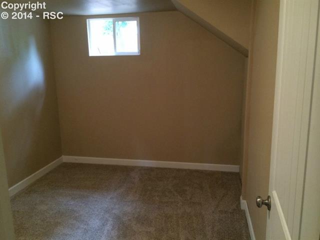838 East Rio Grande Street Colorado Springs, CO 80903 - Photo 16 of 25 Bedroom 3 with walk in closet & under stair storage