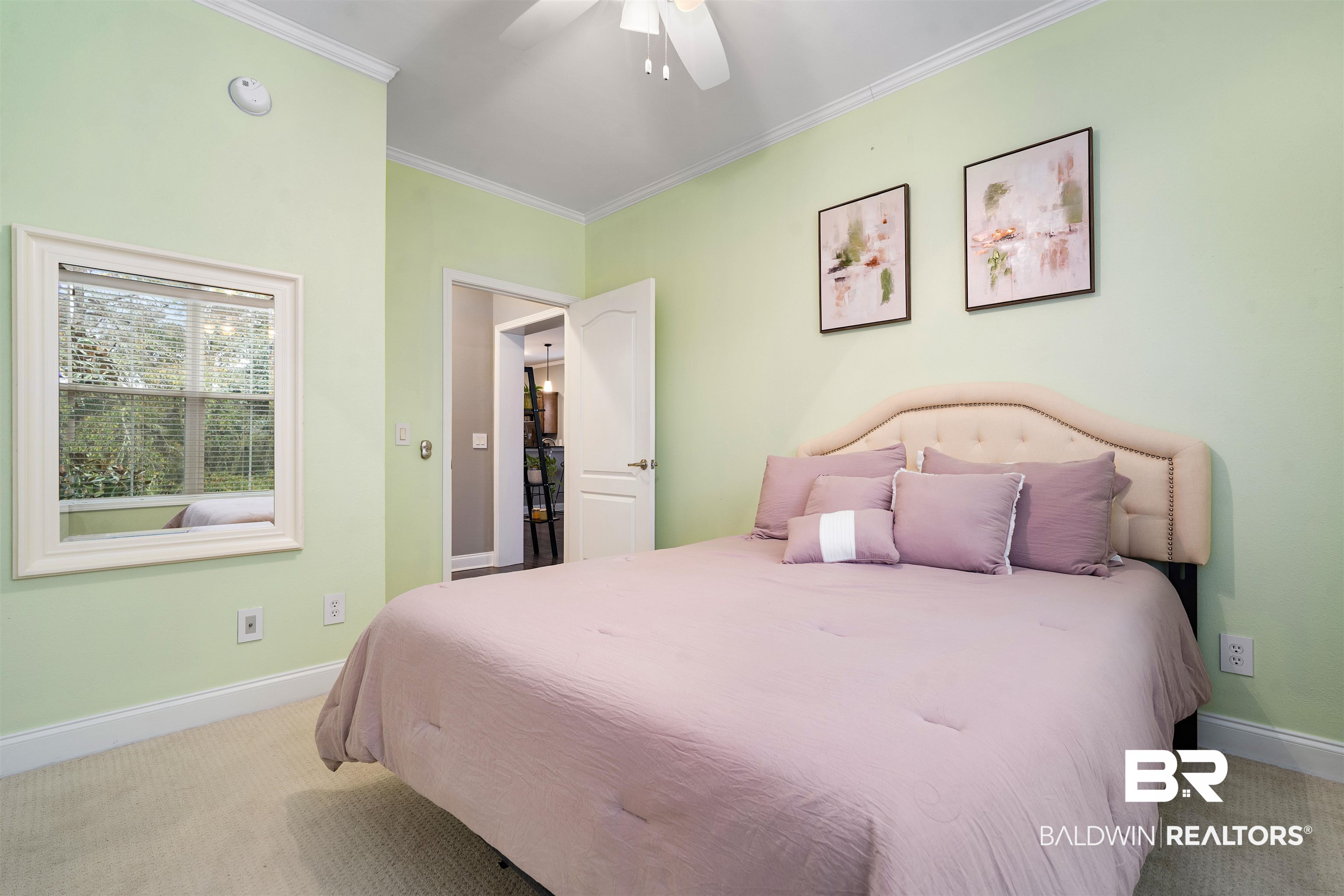 25806 Pollard Road, Unit 205 Daphne, AL 36526 - Photo 16 of 26 Bedroom with ornamental molding, light carpet, and a ceiling fan