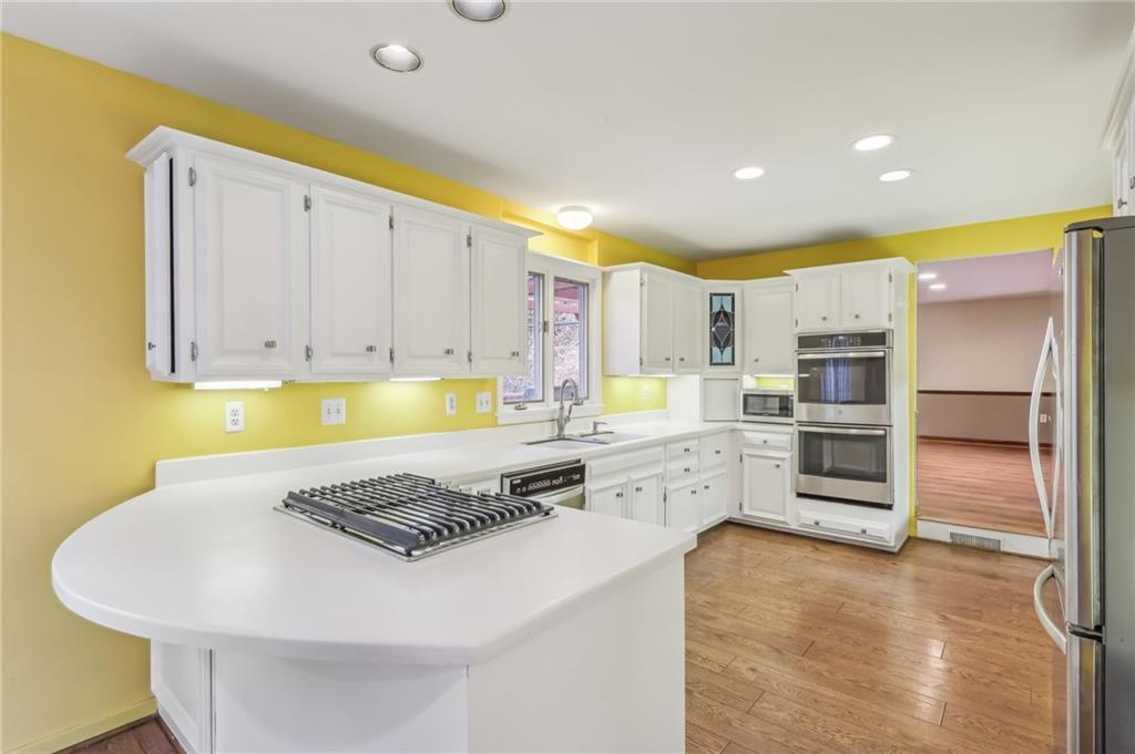 1577 Bellmonte Road Pittsburgh, PA 15237 - Photo 10 of 19 Kitchen opens to dining room and also the kitchen is open to the Den/office/playroom… with door to the backyard and deck.