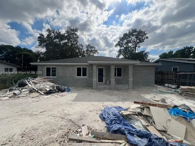 a view of a yard and front view of a house