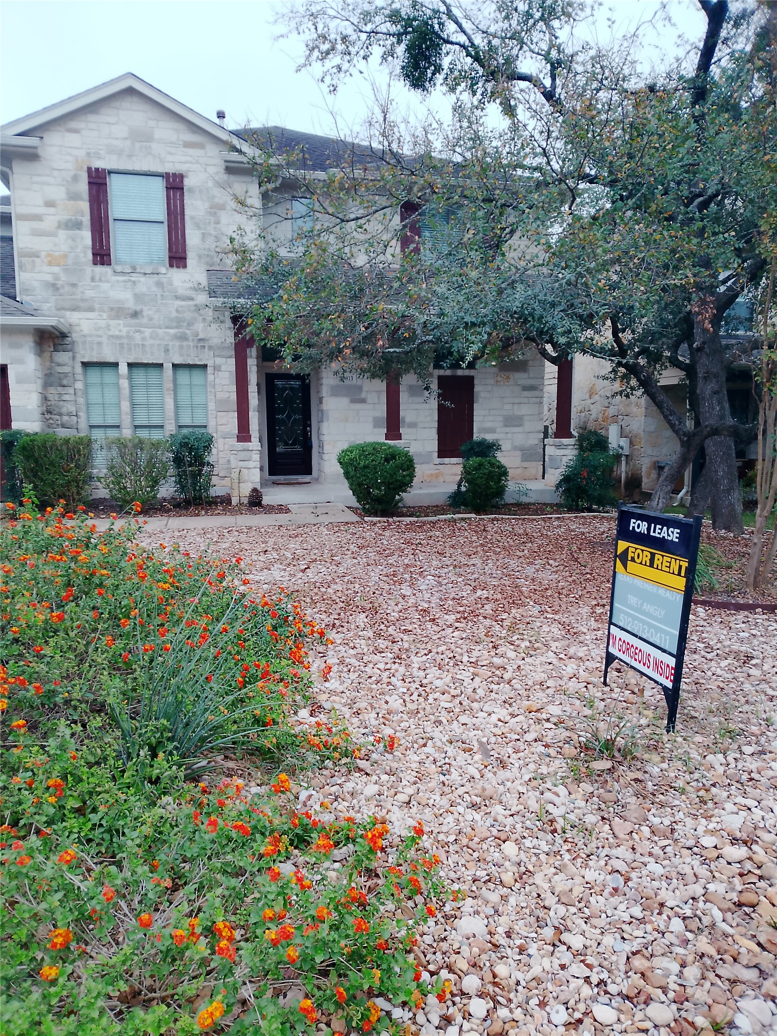 10813 Cap Stone Drive Austin, TX 78739 - Photo 2 of 13 View of front of home with stone siding, note- low maintenance front yard