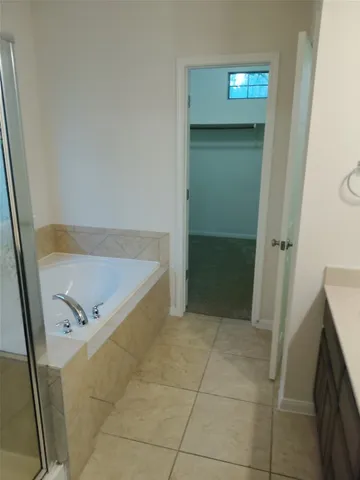 a kitchen with stainless steel appliances a sink a stove a microwave a counter top and cabinets