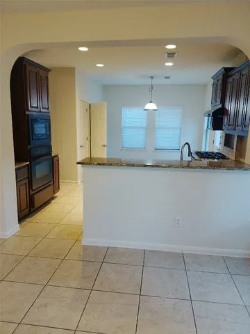a view of fireplace with wooden floor