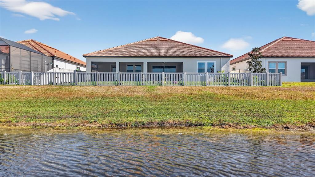 17109 Star Banks Street Wimauma, FL 33598 - Photo 37 of 60 a front view of a house with a yard