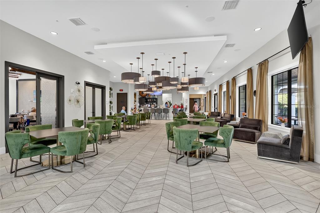 17109 Star Banks Street Wimauma, FL 33598 - Photo 41 of 60 a living room with lots of furniture and a large window