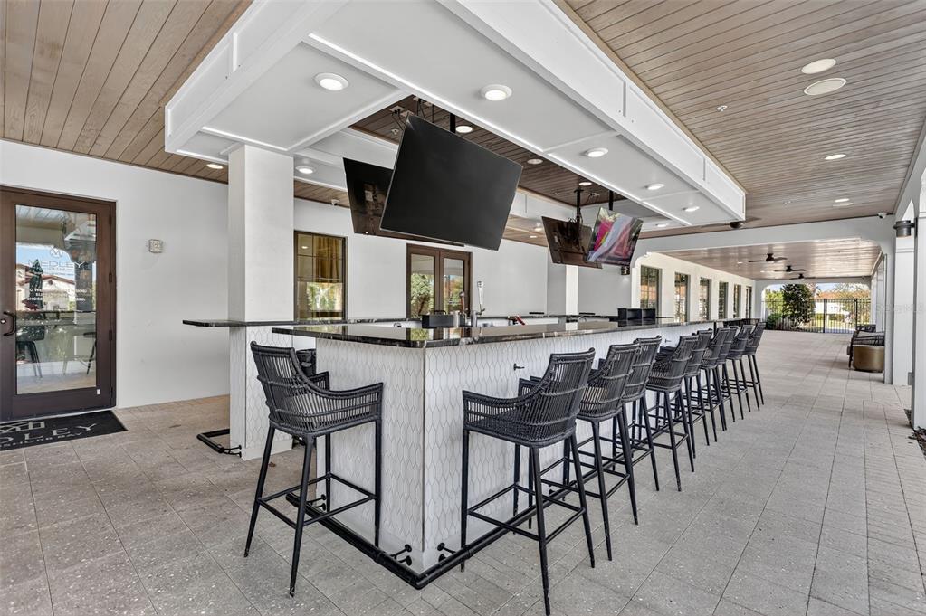 17109 Star Banks Street Wimauma, FL 33598 - Photo 46 of 60 a group of people sitting at tables in a room