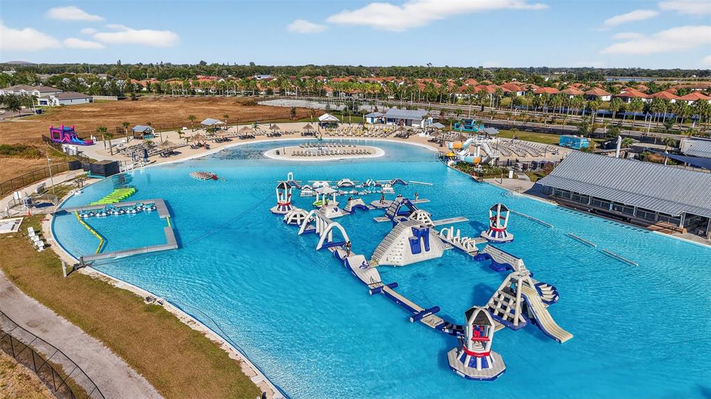17109 Star Banks Street Wimauma, FL 33598 - Photo 56 of 60 an aerial view of a patio swimming pool and outdoor seating