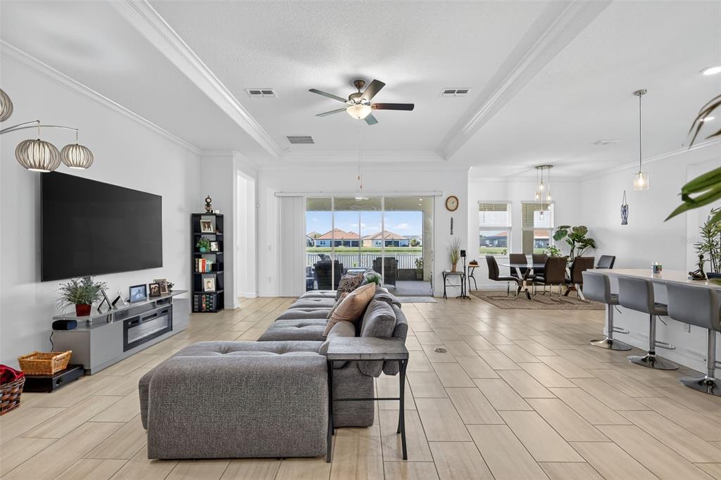 17109 Star Banks Street Wimauma, FL 33598 - Photo 7 of 60 a living room with furniture and a flat screen tv