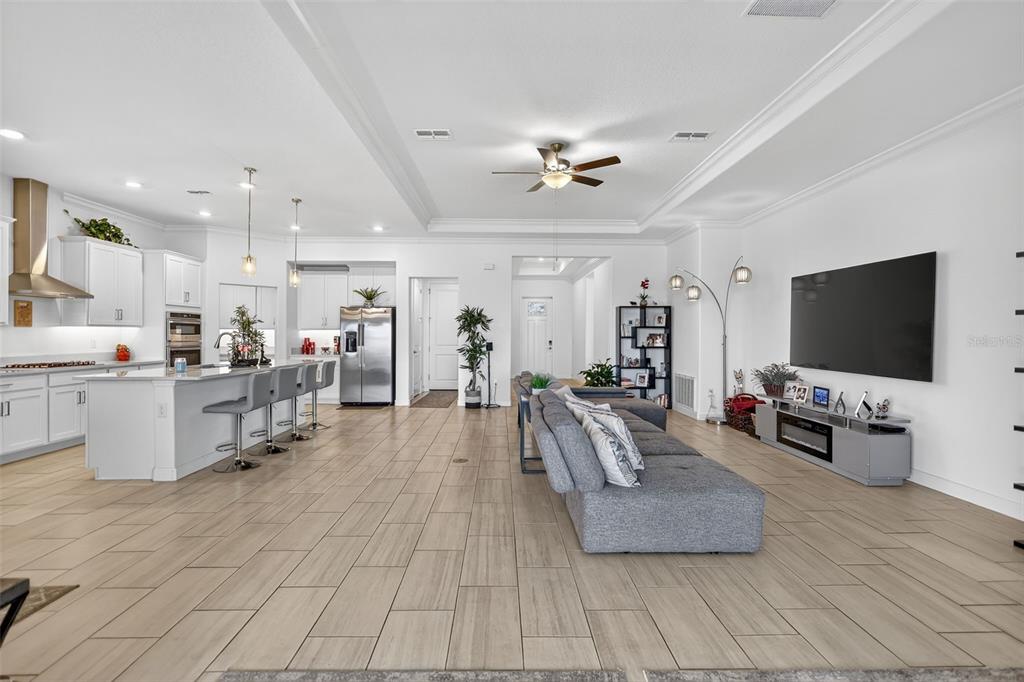 17109 Star Banks Street Wimauma, FL 33598 - Photo 8 of 60 a living room with furniture and a flat screen tv