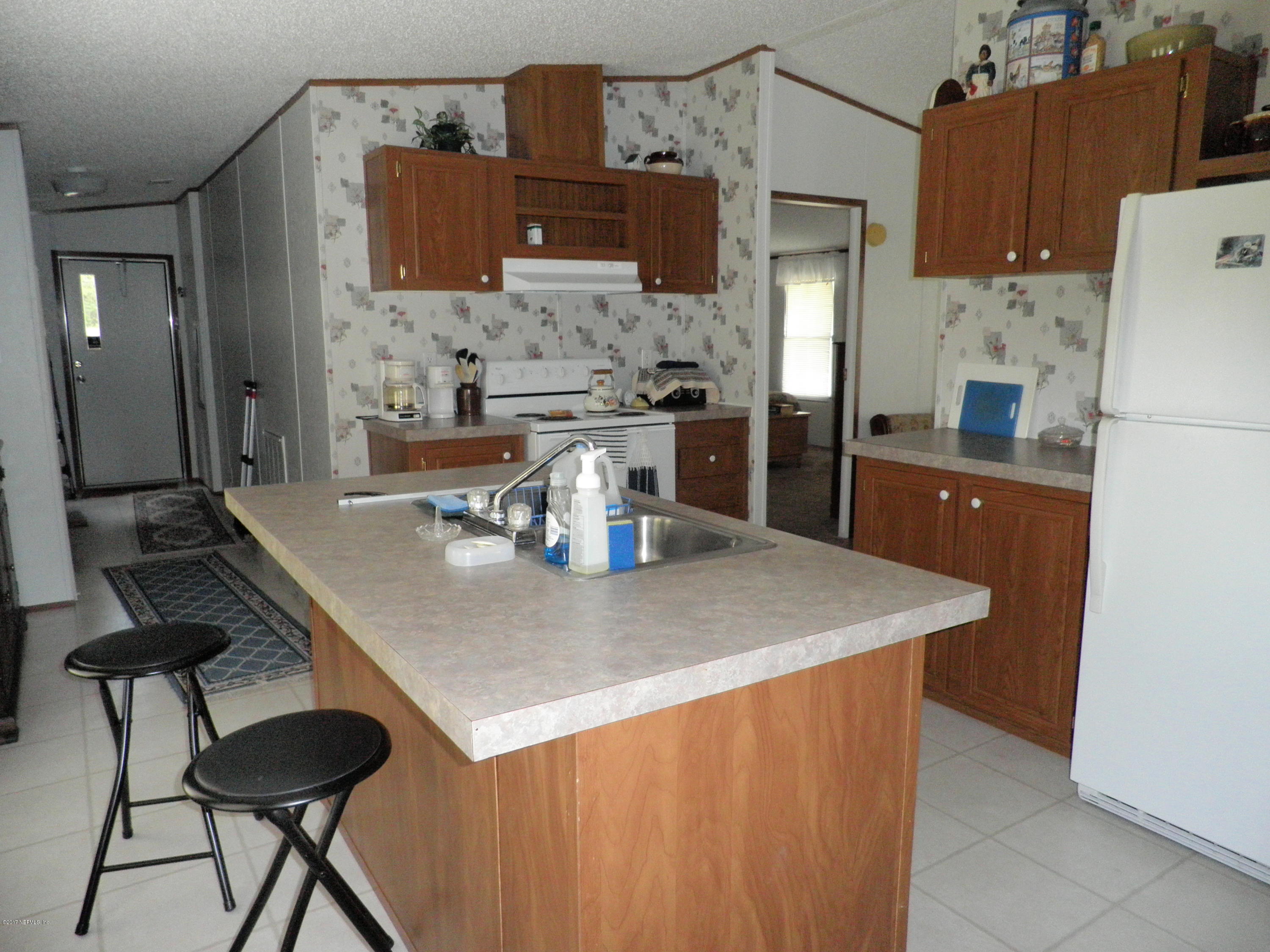 269 Beulah Church Road Welaka, FL 32112 - Photo 12 of 20 ISLAND IN KITCHEN