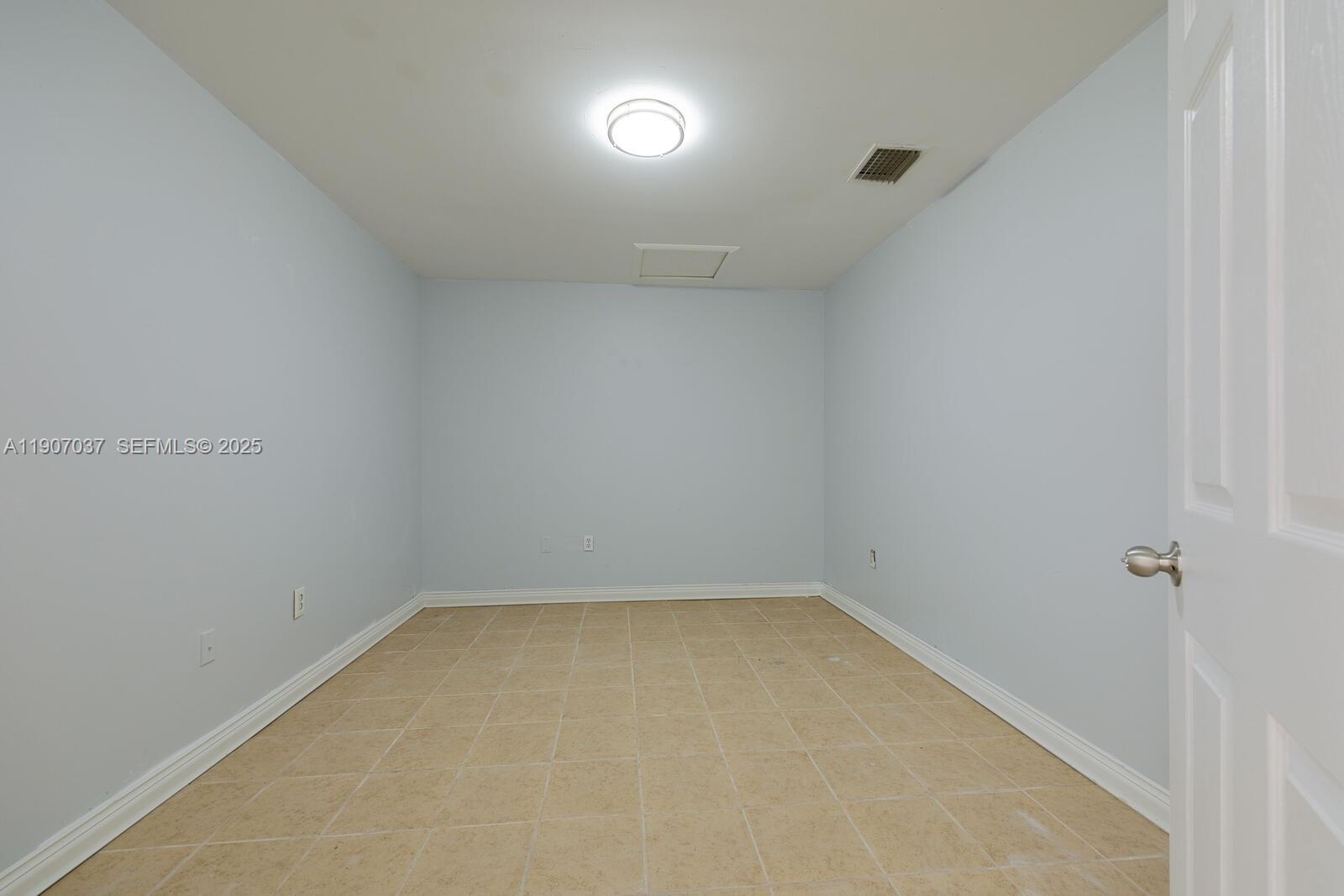 28147 Southwest 142nd Court Homestead, FL 33033 - Photo 12 of 16 a view of an empty room