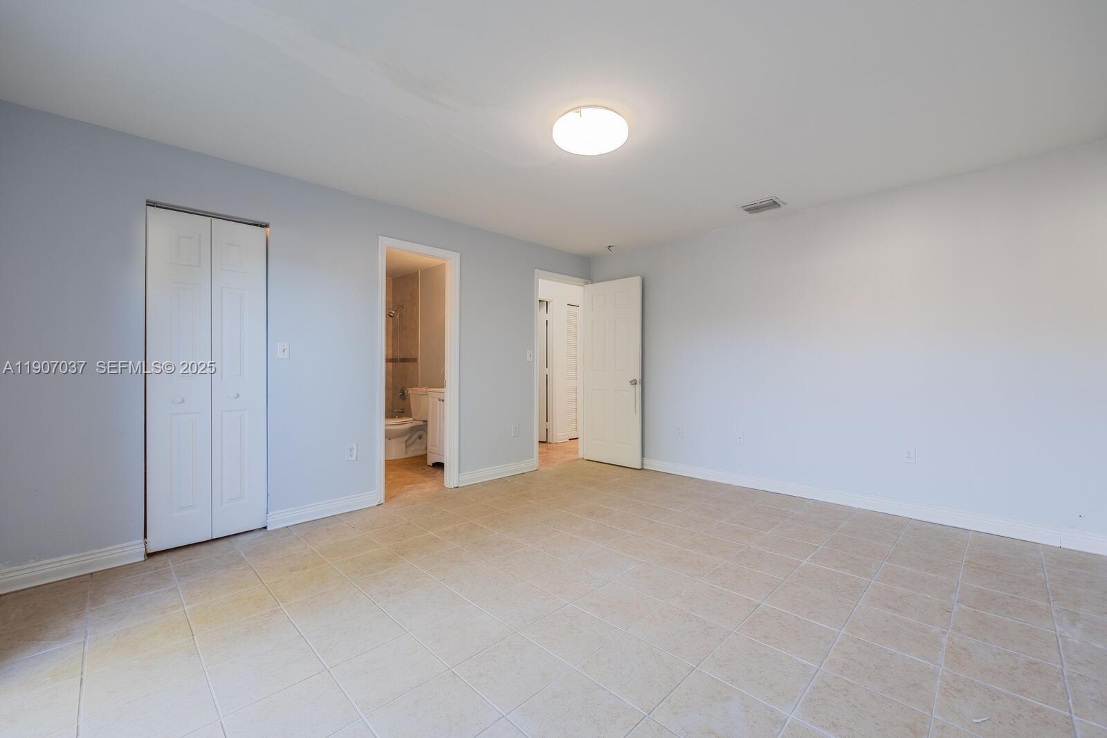 28147 Southwest 142nd Court Homestead, FL 33033 - Photo 8 of 16 a view of empty room