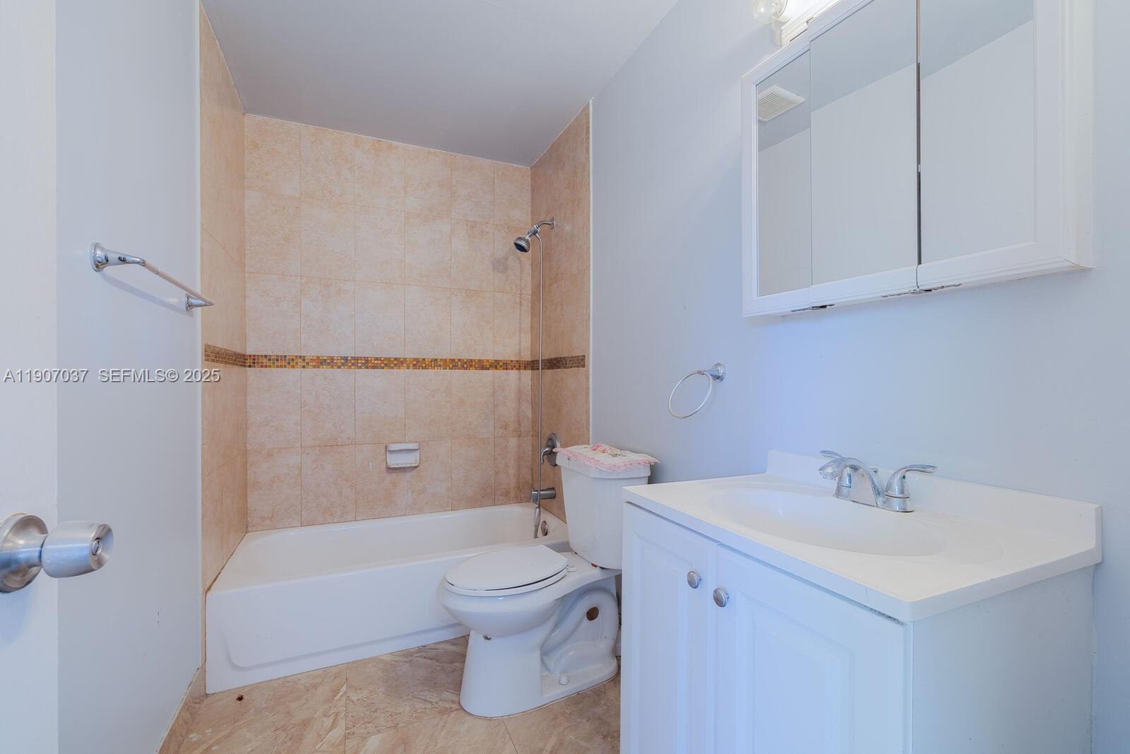 28147 Southwest 142nd Court Homestead, FL 33033 - Photo 10 of 16 a bathroom with a sink a toilet and shower