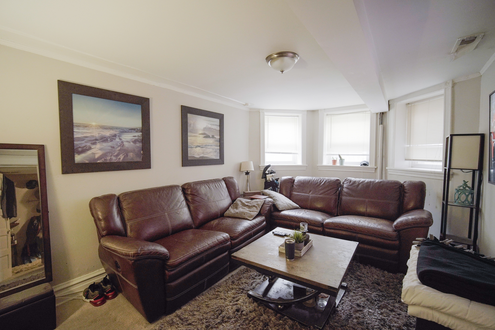 1077 North Paulina Street, Unit G Chicago, IL 60622 - Photo 2 of 6 a living room with furniture a couch and a flat screen tv