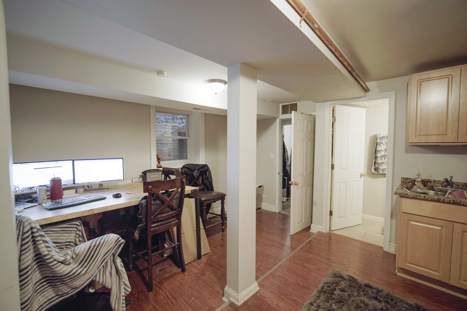 1077 North Paulina Street, Unit G Chicago, IL 60622 - Photo 3 of 6 a kitchen with stainless steel appliances granite countertop a refrigerator and a stove