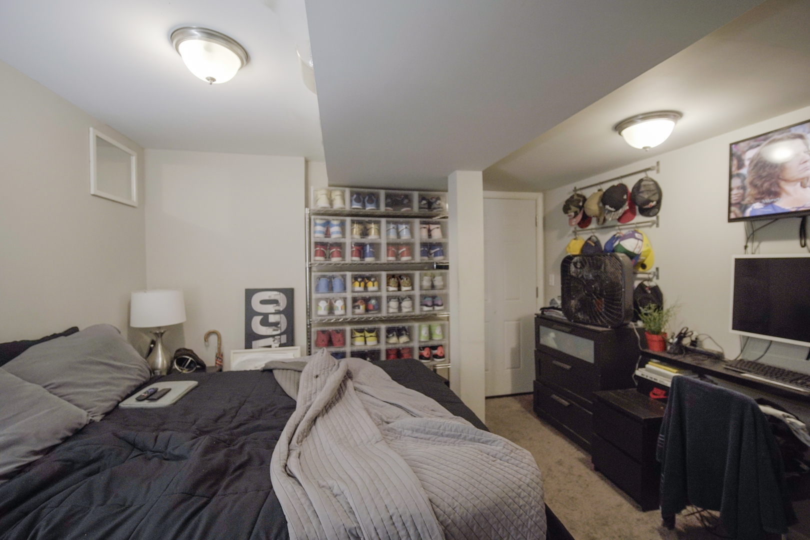 1077 North Paulina Street, Unit G Chicago, IL 60622 - Photo 6 of 6 a bedroom with a bed and a flat screen tv