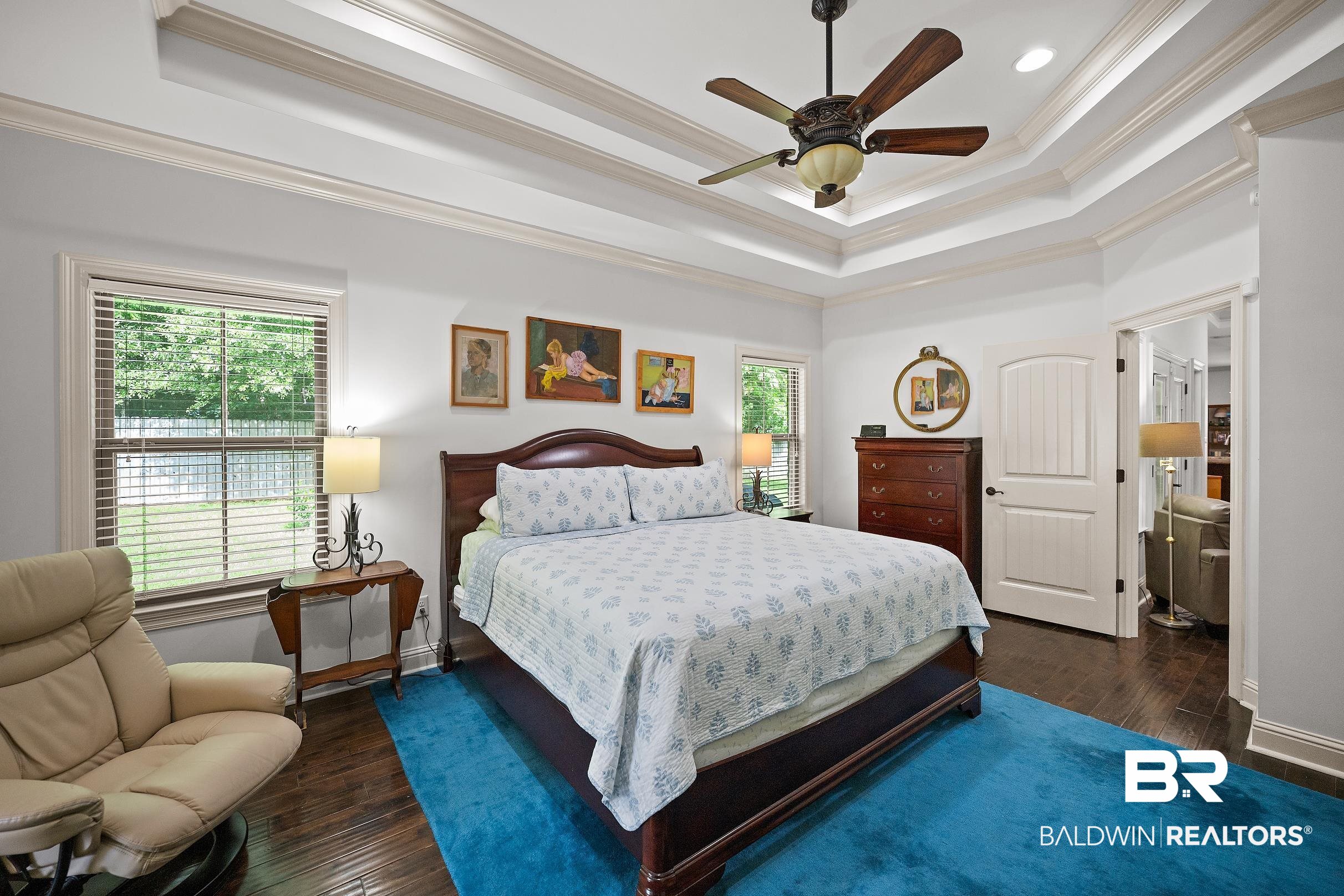 313 Pecan Ridge Boulevard Fairhope, AL 36532 - Photo 13 of 51 Tray ceiling with crown molding and a ceiling fan
