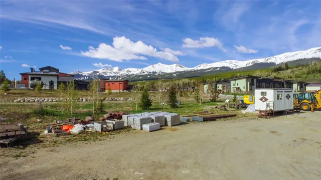 a view of a garden with a building in the background