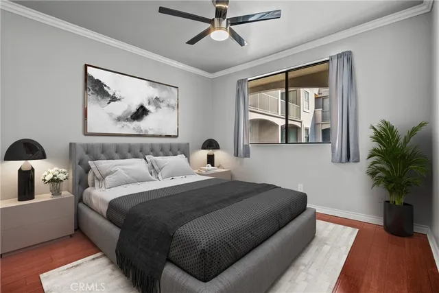 a bedroom with a large bed and a chandelier