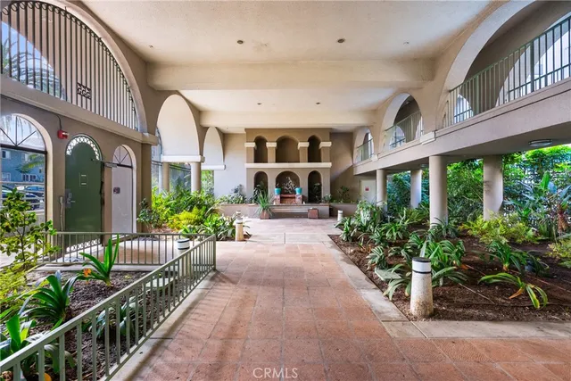 a view of a garden with an outdoor seating