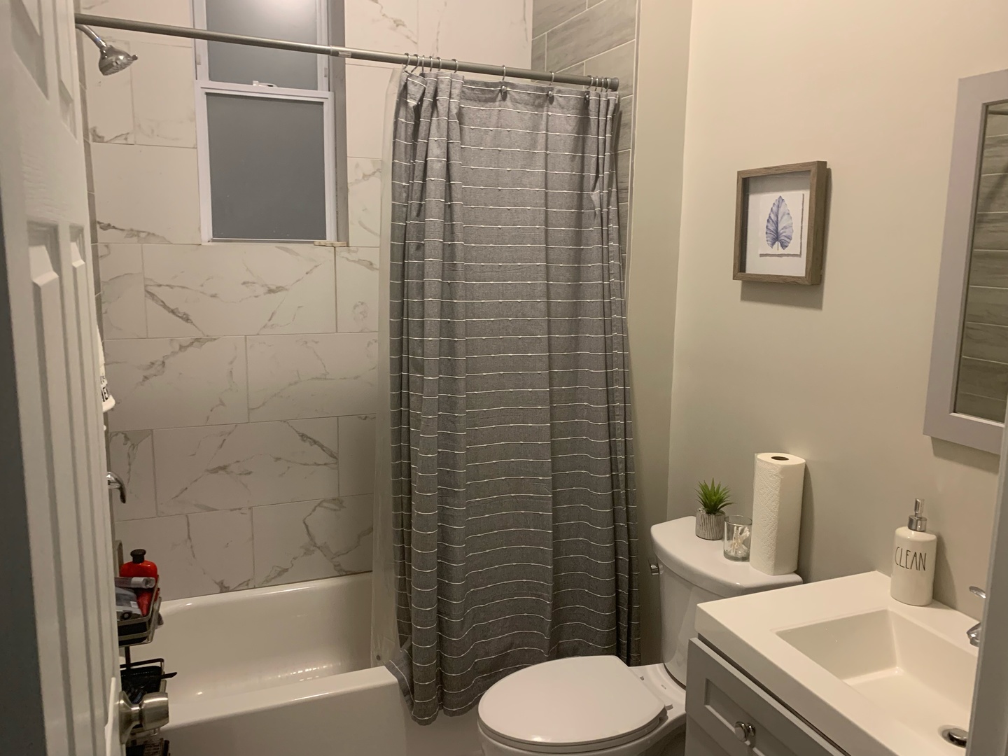 827 West 33rd Place, Unit 2F Chicago, IL 60608 - Photo 11 of 23 a bathroom with a sink toilet and shower