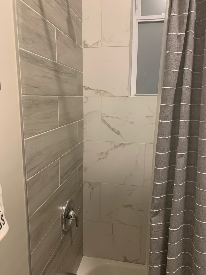 827 West 33rd Place, Unit 2F Chicago, IL 60608 - Photo 12 of 23 a bathroom with a shower