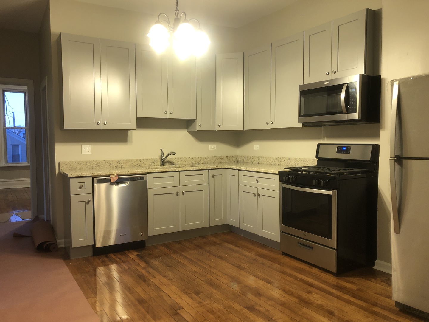 827 West 33rd Place, Unit 2F Chicago, IL 60608 - Photo 2 of 23 a kitchen with a sink stove and microwave