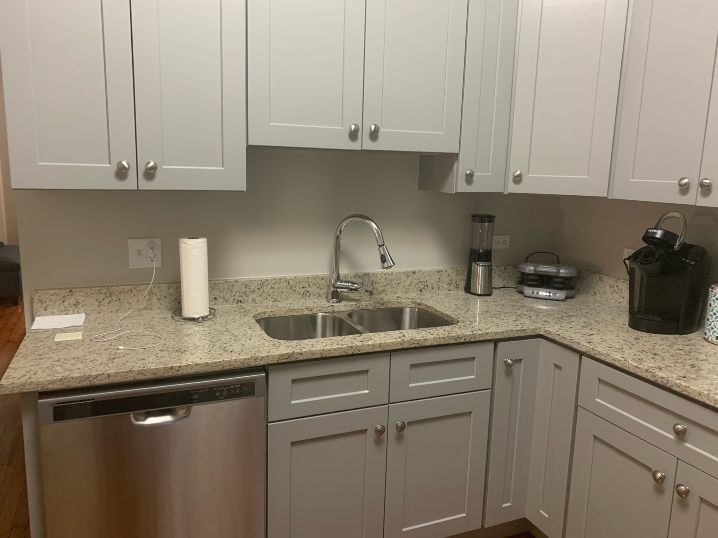 827 West 33rd Place, Unit 2F Chicago, IL 60608 - Photo 3 of 23 a kitchen with granite countertop white cabinets and a sink