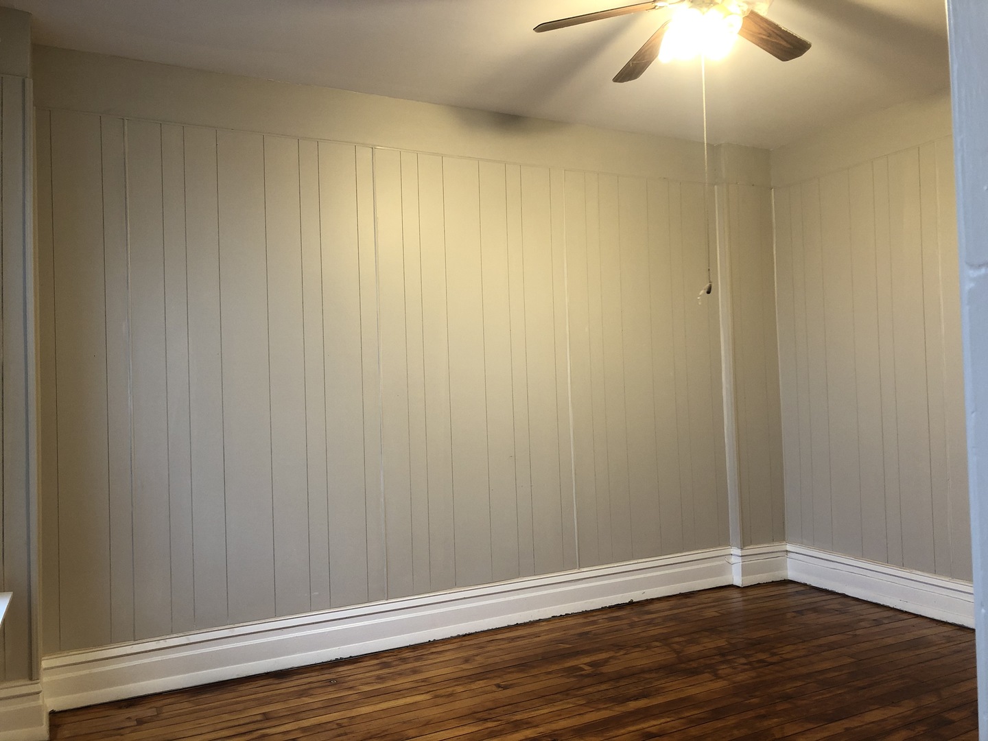 827 West 33rd Place, Unit 2F Chicago, IL 60608 - Photo 9 of 23 a view of an empty room with wooden floor