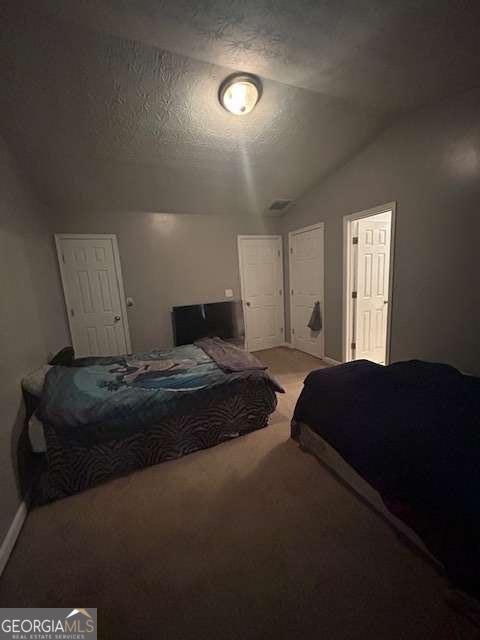 2918 Vining Ridge Terrace, Unit 99 Decatur, GA 30034 - Photo 13 of 16 a bedroom with a bed and a night stand