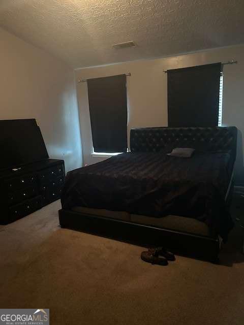 2918 Vining Ridge Terrace, Unit 99 Decatur, GA 30034 - Photo 15 of 16 a bedroom with a bed and a television