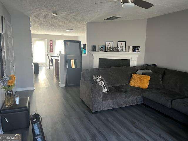 2918 Vining Ridge Terrace, Unit 99 Decatur, GA 30034 - Photo 5 of 16 a living room with furniture and a couch