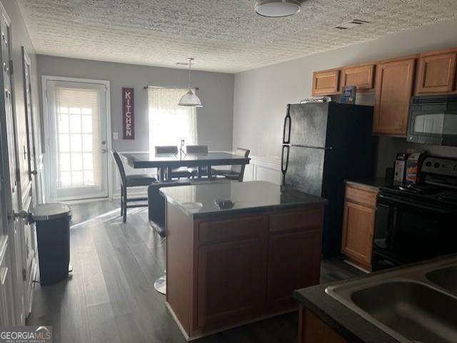 2918 Vining Ridge Terrace, Unit 99 Decatur, GA 30034 - Photo 7 of 16 a kitchen with stainless steel appliances granite countertop a refrigerator a stove a sink a dining table and chairs