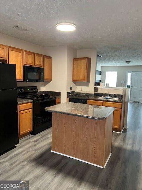 2918 Vining Ridge Terrace, Unit 99 Decatur, GA 30034 - Photo 8 of 16 a kitchen with stainless steel appliances granite countertop a stove a sink and a microwave