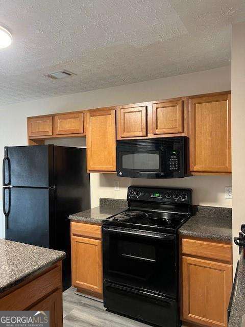 2918 Vining Ridge Terrace, Unit 99 Decatur, GA 30034 - Photo 9 of 16 a kitchen with a refrigerator stove and microwave