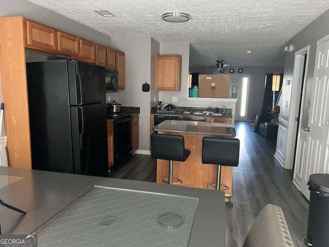 2918 Vining Ridge Terrace, Unit 99 Decatur, GA 30034 - Photo 10 of 16 a kitchen with a refrigerator a stove and chairs