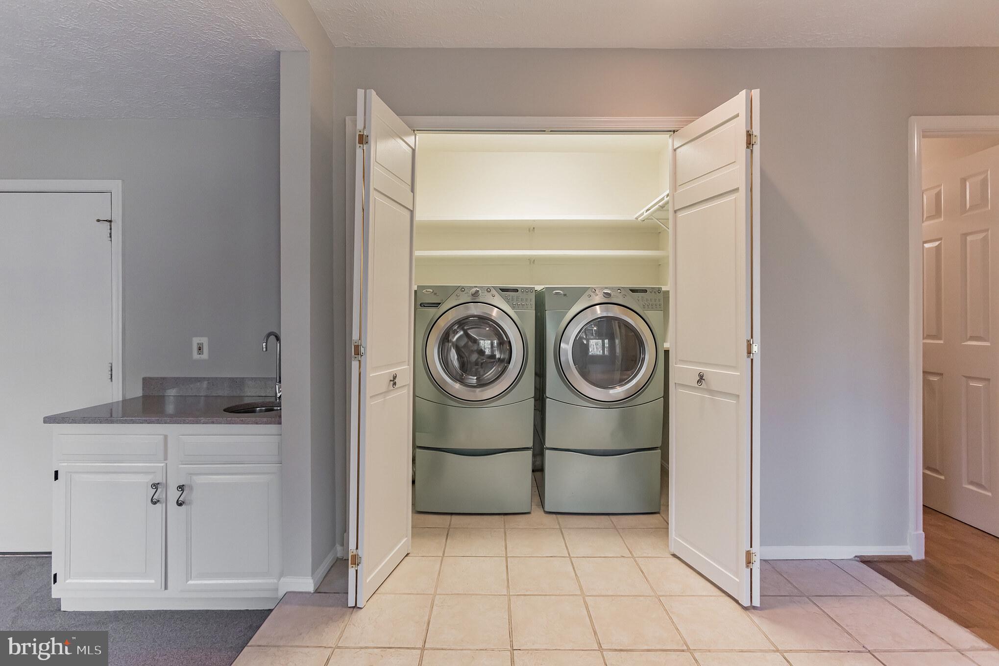 12905 Ruxton Road Silver Spring, MD 20904 - Photo 11 of 31 Washer and dryer and wet bar main level