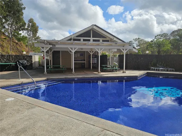 a view of a backyard with sitting area