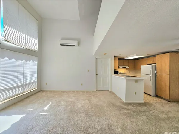 a kitchen with a refrigerator a sink and a stove