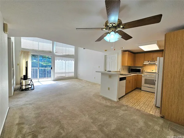 a view of an empty room with a flat screen tv